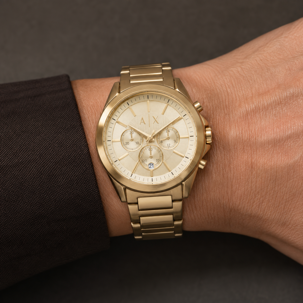 Armani Exchange AX2602 men's gold chronograph watch on inner wrist