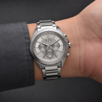 Armani Exchange AX2603 men's silver chronograph watch on inner wrist