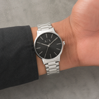 Armani Exchange AX2700 men's silver black minimalist watch on inner wrist