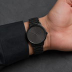 Armani Exchange AX2701 men's all black minimalist watch on inner wrist
