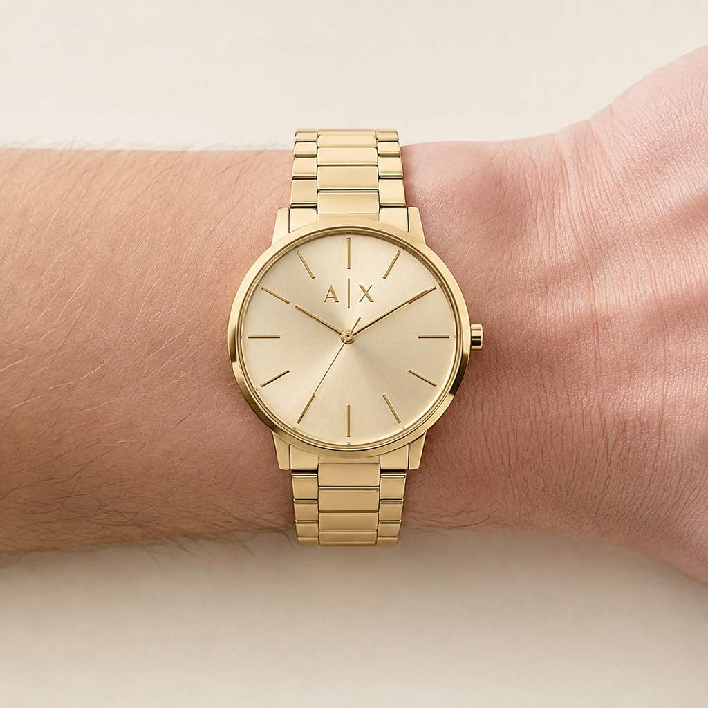 Armani Exchange AX2707 men's gold watch on inner wrist