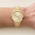 Armani Exchange AX2707 men's gold watch on inner wrist