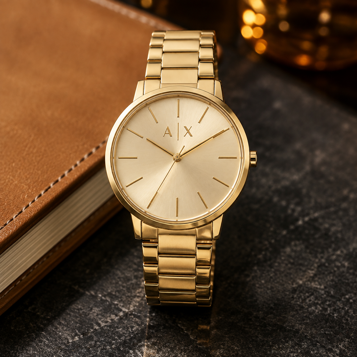 Armani Exchange AX2707 gold watch desk scene