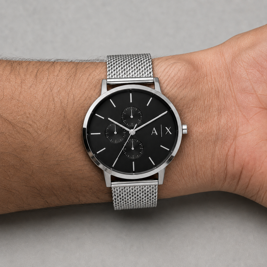 Armani Exchange AX2714 men's silver mesh watch on inner wrist