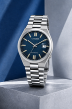 Citizen NJ0151-88L blue dial automatic watch on a cool blue-grey stone display