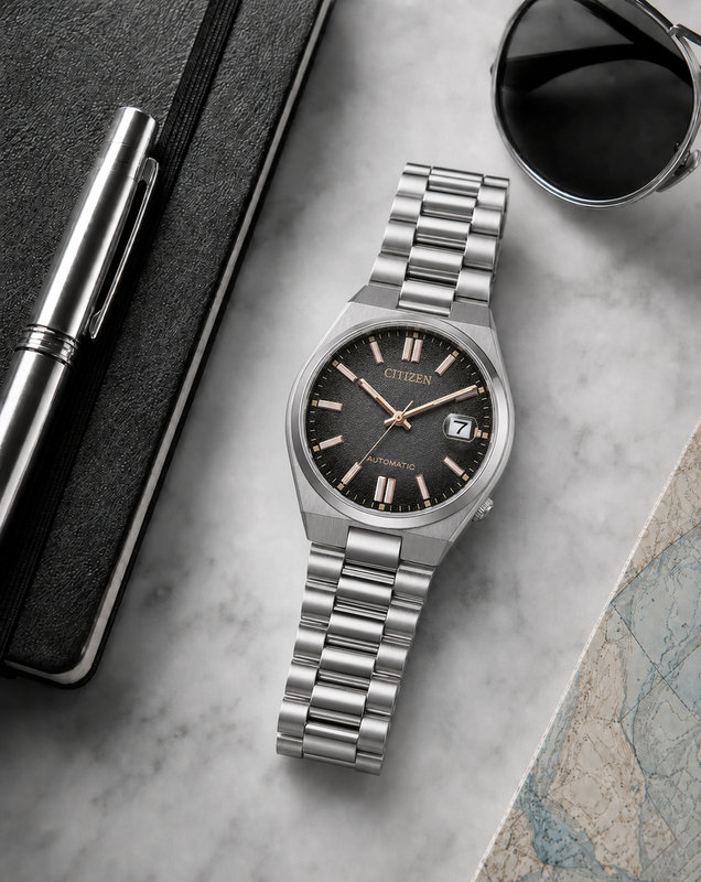 Citizen NJ0200-50E black dial automatic watch in a premium marble flat-lay