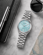 Citizen NJ0200-50L ice blue dial automatic watch in a premium marble flat-lay