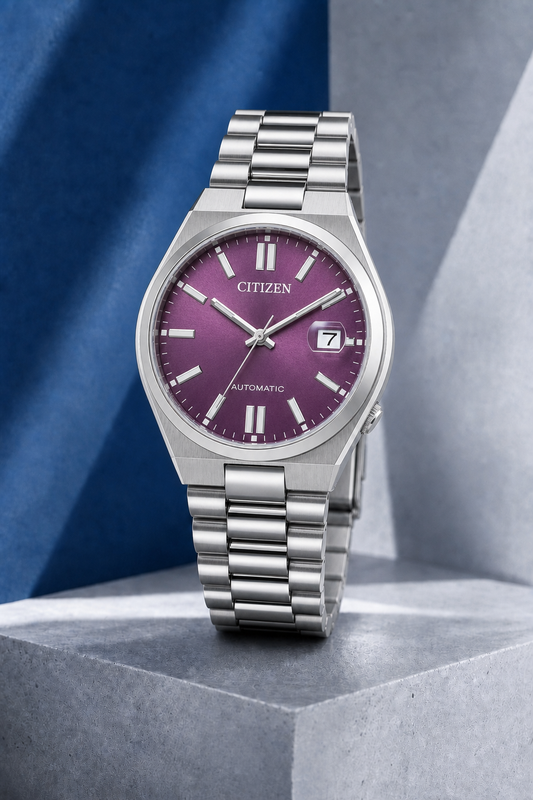 Citizen NJ0200-50W purple dial automatic watch on a cool blue-grey stone display