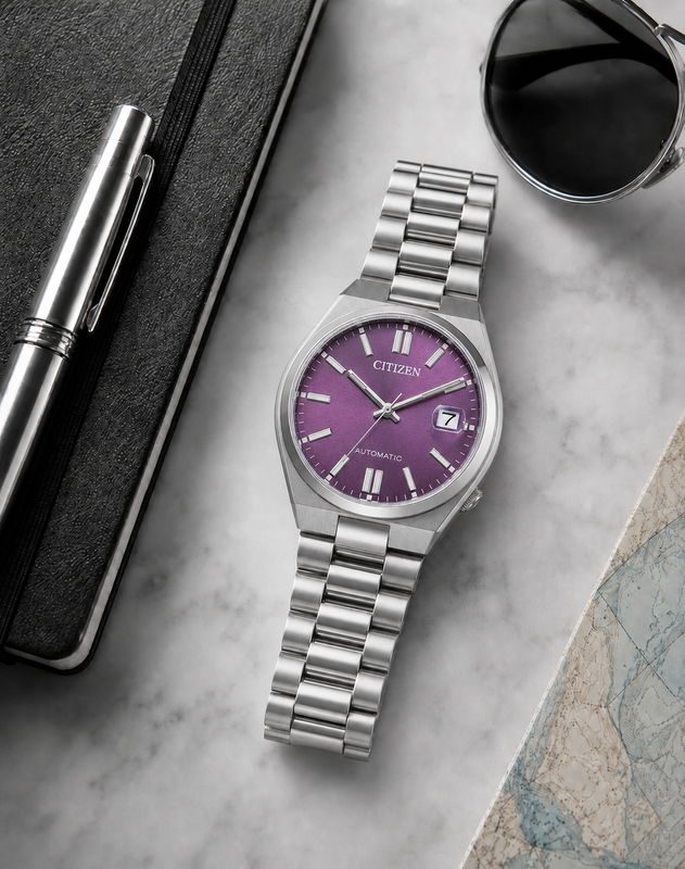 Citizen NJ0200-50W purple dial automatic watch in a premium marble flat-lay