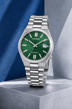 Citizen NJ0200-50X green dial automatic watch on a cool blue-grey stone display