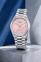 Citizen NJ0200-50Z pink dial automatic watch on a cool blue-grey stone display
