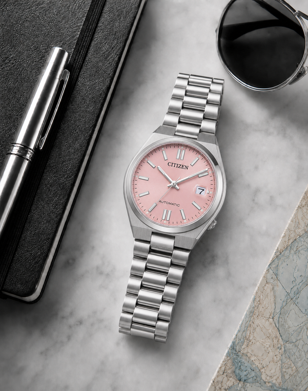 Citizen NJ0200-50Z pink dial automatic watch in a premium marble flat-lay