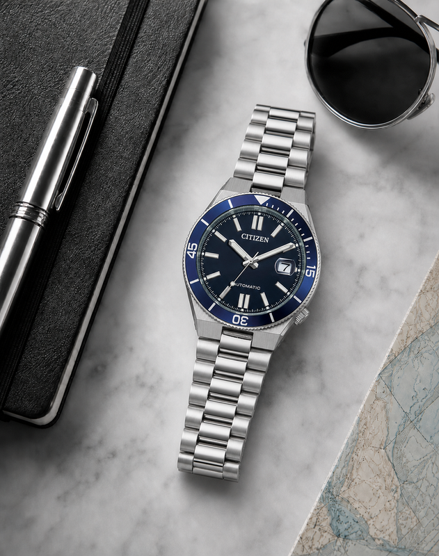 Citizen NJ0230-59L blue dial automatic watch in a premium marble flat-lay