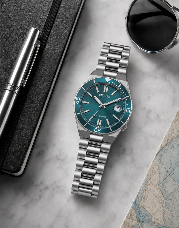 Citizen NJ0231-56L turquoise dial automatic watch in a premium marble flat-lay