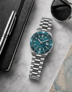 Citizen NJ0231-56L turquoise dial automatic watch in a premium marble flat-lay