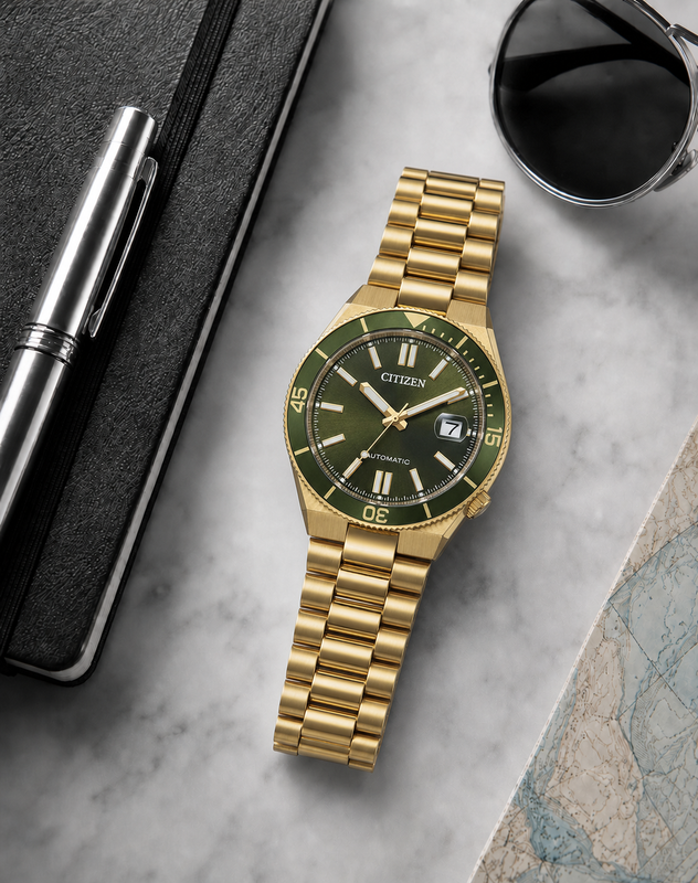 Citizen NJ0232-53X green dial automatic watch in a premium marble flat-lay