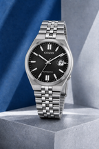 Citizen NK0020-55E black dial automatic watch on a cool blue-grey stone display
