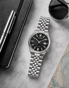 Citizen NK0020-55E black dial automatic watch in a premium marble flat-lay