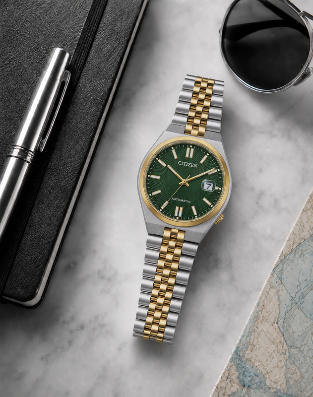 Citizen NK0024-54X green dial automatic watch in a premium marble flat-lay