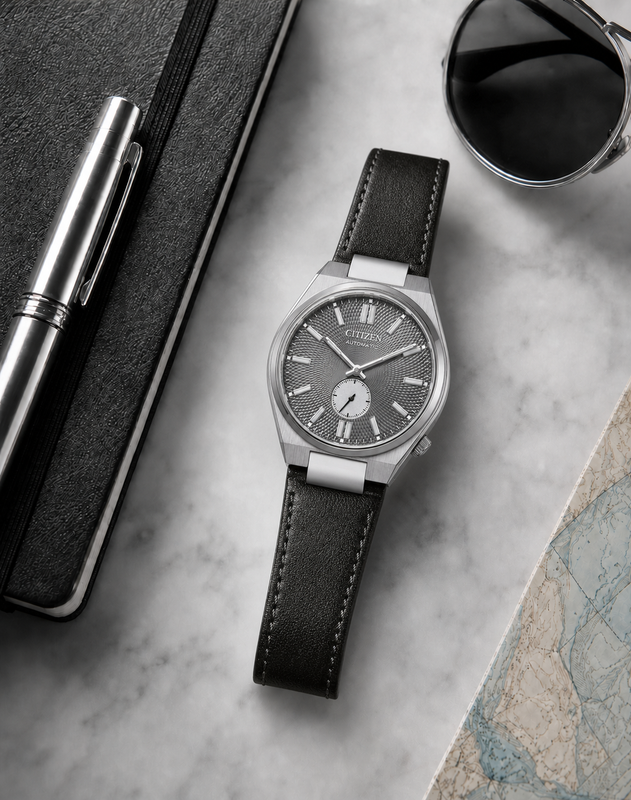 Citizen NK5010-01H grey dial automatic watch in a premium marble flat-lay