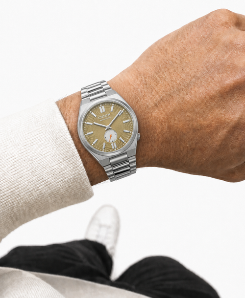 Citizen NK5010-51X gold dial automatic watch worn naturally on the wrist