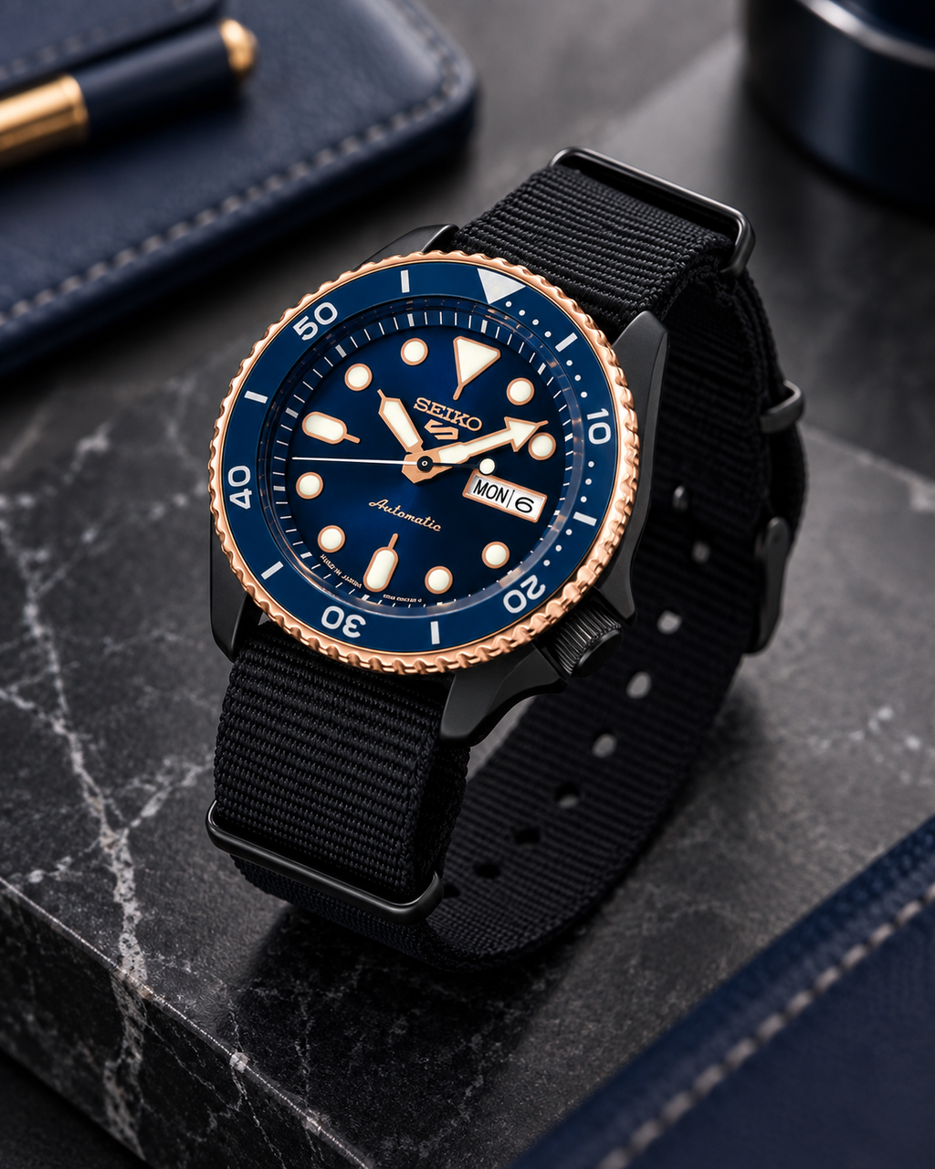 Seiko 5 Sports SBSA098 automatic watch on dark marble