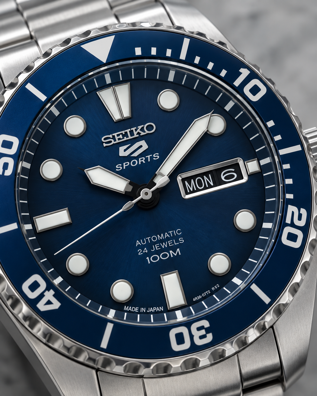 Seiko 5 Sports SRPC63J1 blue dial day-date automatic watch macro detail