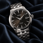 Seiko Presage Cocktail Time SRPE17J1 automatic dark dial stainless steel watch on midnight blue fabric