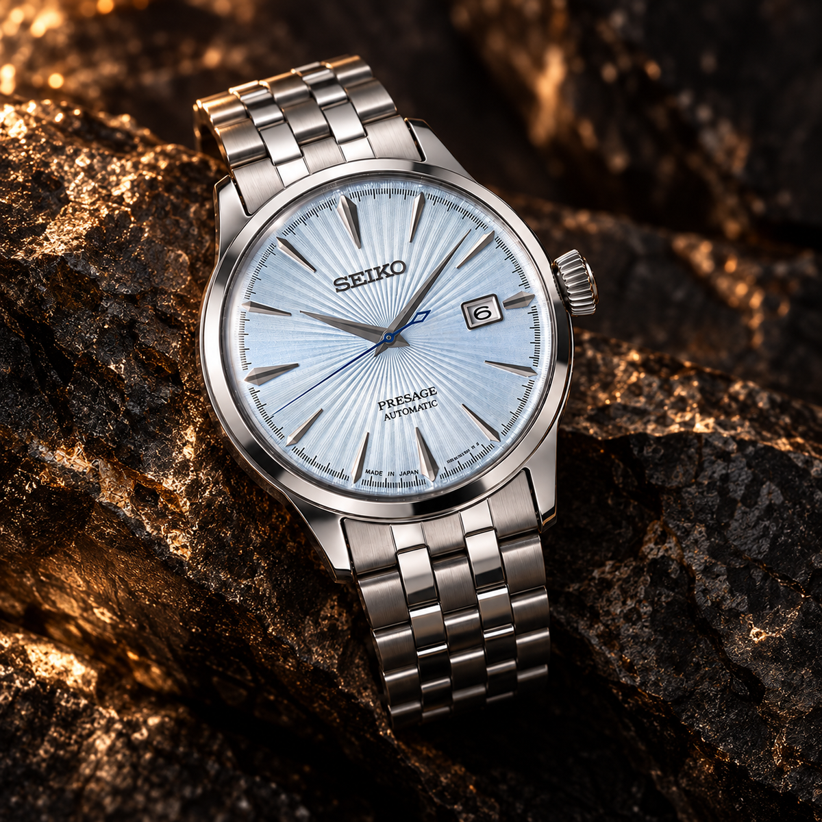 Seiko Presage Cocktail Time SRPE19J1 automatic light blue dial watch on dramatic dark stone