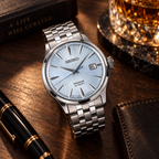 Seiko Presage Cocktail Time SRPE19J1 automatic watch on a curated luxury desk with warm lighting