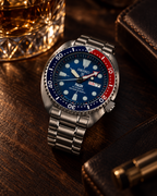 Seiko Prospex PADI Turtle SRPE99 automatic diver's watch in warm premium editorial still-life lighting