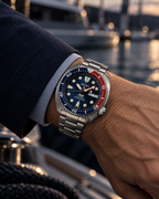 Seiko Prospex PADI Turtle SRPE99K1 automatic diver's watch on wrist, blue dial, red-blue bezel, stainless steel bracelet