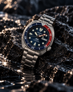 Seiko Prospex PADI Turtle SRPE99K1 automatic diver's watch on wet volcanic rock