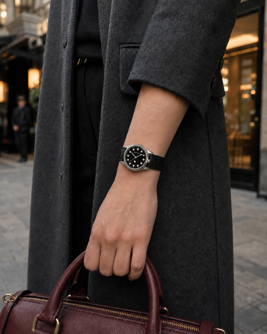 Gucci G-Timeless YA1265055 watch styled with a charcoal coat and burgundy handbag