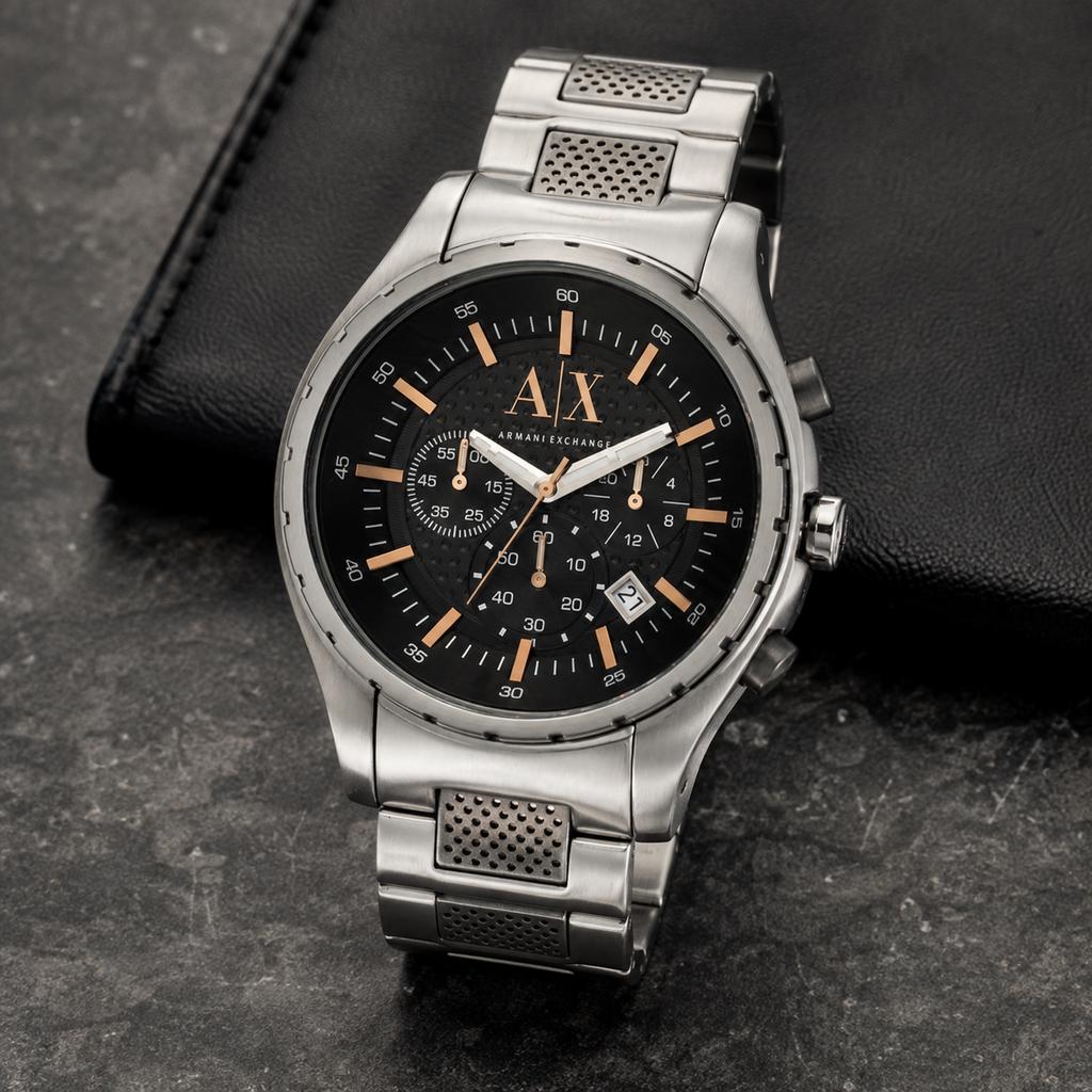 Armani Exchange AX1093 silver chronograph watch on a dark desk