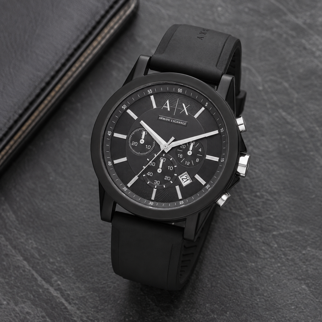 Armani Exchange AX1326 black chronograph watch on a dark desk