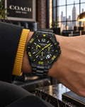 Coach Kent 14602563 black and yellow carbon-fiber chronograph on wrist