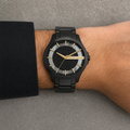 Armani Exchange AX2192 men's black and gold watch on wrist