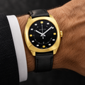Gucci GG2570 YA142310 worn upright on a man's wrist