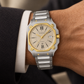 Gucci G-Flat YA166403 automatic two-tone watch worn on wrist