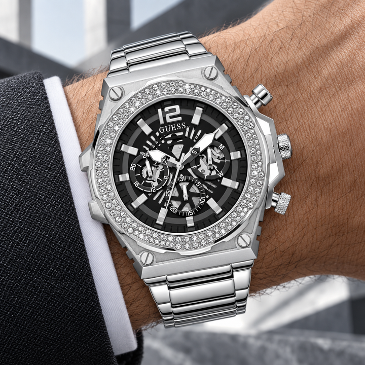GUESS Men's Silver-Tone Crystal Multi-function Watch – Phoenix, Black skeleton-style dial with luminous hands and markers, Silver-tone stainless-steel bracelet with folding clasp, 48 mm – GW0632G1