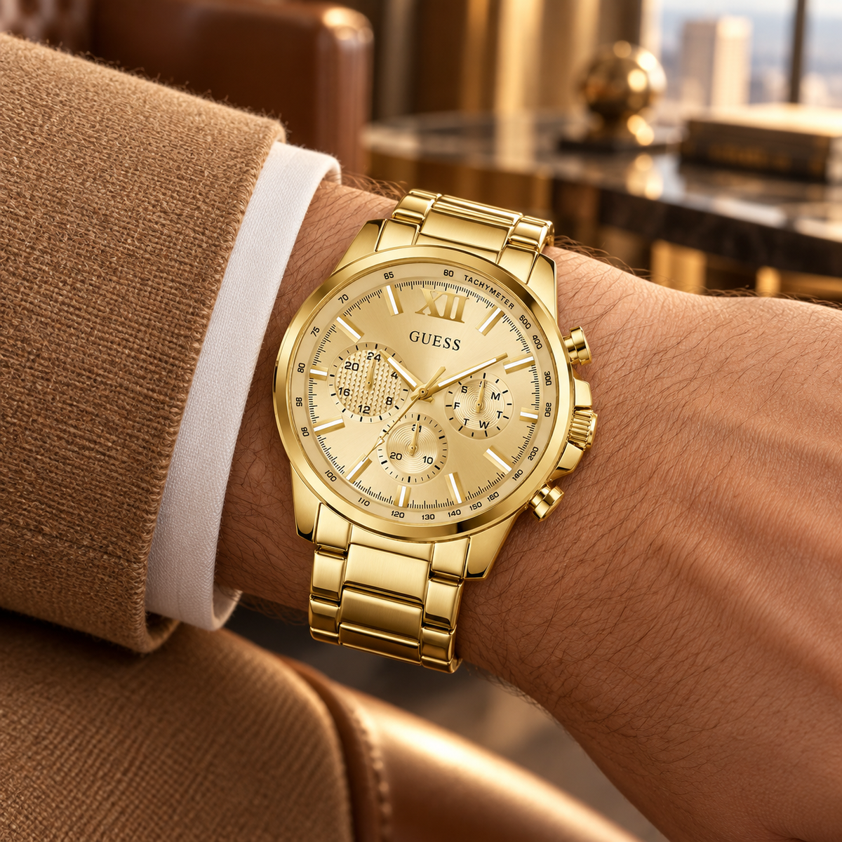 GUESS Mens Gold Tone Multi-function Watch – Phoenix, Black chrono-look multi-function dial, Gold-tone recycled-steel bracelet – GW0900G2 – image 1