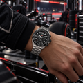 TAG Heuer Formula 1 Chronograph CAZ1010.BA0842 steel watch on racing driver wrist